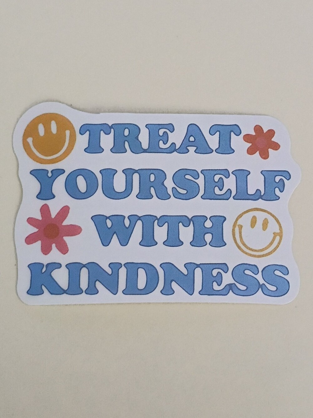 10/$10 Sticker - Treat Yourself With Kindness - Blue Capital Text, Smiley Faces